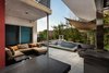Modern home with Outdoor, Landscape Lighting, Pavers Patio, Porch, Deck, Lap Pools, Tubs, Shower, Wood Fences, Wall, Shrubs, and Back Yard. Private patio and pool Photo 4 of The Monarch