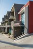 Modern home with Exterior, Apartment Building Type, Metal Roof Material, Metal Siding Material, Mid-Century Building Type, Stucco Siding Material, and Flat RoofLine. Main Entry Photo 10 of The Monarch