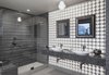 Modern home with Bath Room, Engineered Quartz Counter, Vessel Sink, Enclosed Shower, Corner Shower, Pendant Lighting, Ceiling Lighting, Stone Slab Wall, Full Shower, Wall Lighting, and One Piece Toilet. A Thousand Watt Bathroom Photo of A Thousand Watt Bathroom