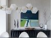 Modern home with Dining Room, Storage, and Pendant Lighting. Triggs continues, "For the dining room we focused on linear, distinct angles that complimented each other. We wanted a mix of sleek lines and smooth shapes reminiscent of the race cars our client loved. We started with the buffet console from the Hewn showroom's Erinn V. Collection. I love this piece. Its three dimensional, angular and so incredibly elegant. Everything else was chosen to compliment the buffet." Photo 4 of Contemporary Cool Sausalito Bachelor Pad