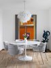 Modern home with Dining Room, Table, Pendant Lighting, and Chair. A vintage chandelier hangs over an Eero Saarinen round table and a set of Strike chairs by Arrmet Studio. Photo 6 of Contemporary Cool Sausalito Bachelor Pad