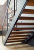 Modern home with Staircase, Metal Railing, Cable Railing, and Wood Tread. King's team added a series of bow ties underneath the stairs to enhance their stability - a discreet but effective solution for this open stairwell. Photo 8 of Details Make the Difference in this San Francisco Urban Loft