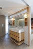 Modern home with Wall Lighting. The master bathroom was devoid of natural light so Murdock added floor to ceiling glazing to the corner of the shower to bring light into the space. An overhead transom was also designed to bring natural light in from the adjacent bedroom. "Due to the building and HOA requirements, we could not add additional exterior windows and openings. We had to get creative in order to bring natural lighting into these spaces, " says Murdock. Photo 12 of Details Make the Difference in this San Francisco Urban Loft
