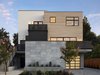 Modern home with Exterior, Stucco Siding Material, Flat RoofLine, and Wood Siding Material. “We worked closely with the developer to design a multi-family project that would give each tenant the feeling of both openness and privacy. The composition of the front facade volumes and terraced spaces hint at the integration of space, form and material and how they will come together to break down the three-story structure to create a distinctive modern design,” says Young. "The building's design reflects not only the mix of existing styles in the neighborhood but the opportunity to explore how massing and material selection can help integrate a bigger, multi-family project into a transitioning community." Photo 2 of Modern Multi-Family Architecture