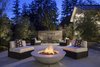The fountain adds a pleasant sound to evening gatherings. By Arterra Landscape Architects Photo 6 of Talk of the Neighborhood modern home