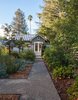 The path leads through the garden to the enclosed terrace, By Arterra Landscape Architects Photo 4 of Talk of the Neighborhood modern home