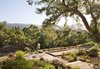 The bocce ball court rests just below the pool and above the barn. It is nestled into the surrounding trees. By Arterra Landscape Architects. Photo by Michele Lee Willson Photo 7 of Homestead on Whiskey Hill modern home