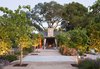 The upper terrace, directly off the pool house, has space for large gatherings. Dogwood trees line the terrace and help shade the area.
By Arterra Landscape Architects. Photo by Michele Lee Willson Photo 5 of Homestead on Whiskey Hill modern home