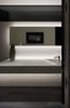 Modern home with Bath Room, Engineered Quartz Counter, Accent Lighting, Porcelain Tile Floor, Undermount Sink, Wall Lighting, One Piece Toilet, and Ceramic Tile Wall. Powder Roomwith custom vanity sink and lighting detail Photo 15 of the Duncan Residence