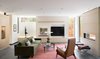 Modern home with Living Room, Ottomans, Bench, Sofa, Chair, Shelves, Ceiling Lighting, Porcelain Tile Floor, Recessed Lighting, Accent Lighting, and Two-Sided Fireplace. Living Room Photo 19 of the Duncan Residence