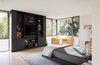 Modern home with Bedroom, Bed, Chair, Ceiling Lighting, Accent Lighting, Lamps, and Light Hardwood Floor. Master Bedroom Photo 16 of the Duncan Residence