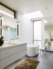 Modern home with Bath Room, Engineered Quartz Counter, Porcelain Tile Floor, Undermount Sink, Freestanding Tub, Ceiling Lighting, Accent Lighting, Enclosed Shower, Porcelain Tile Wall, Recessed Lighting, and One Piece Toilet. Master Bathroom Photo 5 of the Duncan Residence