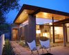 The new living spaces open the house to the outdoors while maintaining privacy in its suburban setting. Photo of The Silvertree Residence modern home