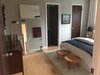 Modern home with Bedroom, Ceiling Lighting, Night Stands, Bed, and Light Hardwood Floor. Guest Bedroom 1 Photo 2 of Disco 3332 in Dallas, TX