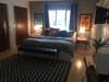 Modern home with Bedroom, Bed, Dresser, Night Stands, Recessed Lighting, Bench, Ceiling Lighting, and Light Hardwood Floor. Master Bedroom Photo 5 of Disco 3332 in Dallas, TX