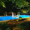 Modern home with Outdoor, Back Yard, Trees, Gardens, Grass, Large Patio, Porch, Deck, Shrubs, Pavers Patio, Porch, Deck, Lap Pools, Tubs, Shower, Stone Patio, Porch, Deck, Wood Fences, Wall, and Landscape Lighting. Dip @ Disco 3332 Night view Photo 11 of Disco 3332 in Dallas, TX