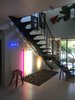 Modern home with Staircase, Metal Railing, and Wood Tread. Floating Staircase Photo 16 of Disco 3332 in Dallas, TX