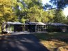 Modern home with Exterior, House Building Type, Wood Siding Material, Gable RoofLine, and Mid-Century Building Type. Front Photo of Hollin Hills 2017 Renovation