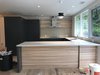 Modern home with Kitchen, Refrigerator, Cooktops, and Open Cabinet. Kitchen during construction. Poggenpohl cabinets customized with ash shelves. Photo 9 of Hollin Hills 2017 Renovation
