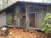 Modern home with Exterior, House Building Type, Wood Siding Material, Prefab Building Type, Mid-Century Building Type, Shingles Roof Material, Gable RoofLine, and Glass Siding Material. Before photo of window wall Photo 2 of Architect's own Home