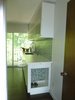 The raised dog feeding area was lined with the waterproof countertop material, and features LED strip lighting. Photo 2 of Modern Laundry, Pantry and Dog Room modern home