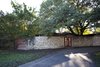 Modern home with Exterior, House Building Type, Metal Roof Material, Concrete Siding Material, and Brick Siding Material. Front before Photo of 1963 Post and Beam Mid Century Modern
