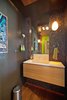 The powder room is at the core of the remodel. It features marble mosaic, a custom mirror, & translucent onyx counter/sink. Photo by: Black Olive Photographic Photo 13 of SMITH Kitchen modern home