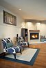A look into the adjacent living room sitting area. An efficient gas insert was added w/ a blower. Photo by: Black Olive Photographic Photo 10 of SMITH Kitchen modern home