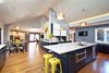 Full gut remodel of kitchen, dining, living room, & bathroom by DII Architeture. The ranch volume is carved out, creating a generous space. Note the grey oak planks on the ceiling & stand-woven bamboo flooring.
Photos by: Black Olive Photographic Photo of SMITH Kitchen modern home