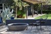 Gravel paves the main terrace overlooking the lower garden and back house. Photo 4 of The Ranch modern home