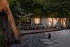 An Ipe wood deck with a custom resin and steel bench frame the dining area in a quiet corner of the garden. Photo 4 of Pasadena Hillside modern home