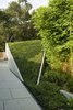 A sculptural concrete garage folds into the garden. Photo 5 of Pasadena Hillside modern home