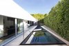 A jewel-like pool and spa fill the narrow master suite garden room. Photo 2 of A New Stage modern home