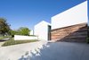 The opaque and mysterious front elevation acts like a drawn curtain to the artful environment inside. Photo 4 of A New Stage modern home