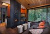 Modern home with Living Room, Standard Layout Fireplace, Medium Hardwood Floor, Recessed Lighting, and Sofa. Family Room Photo 9 of New Tahoe
