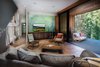 Den with indoor/outdoor patio and Tahoe map Photo 11 of New Tahoe modern home