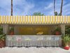 Modern home with Outdoor, Desert, Trees, Concrete Patio, Porch, Deck, and Planters Patio, Porch, Deck. The lemonade stand at the Parker Palm Springs, complete with Bertoia Barstools Photo 3 of Parker Palm Springs