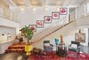 Modern home with Living Room, Rug Floor, Wall Lighting, Chair, Table, Floor Lighting, and Accent Lighting. The stair carpeting in the foyer of the Parker Palm Springs was inspired by hallway flooring from the movie "The Shining." Photo of Parker Palm Springs