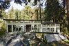 Modern home with Exterior, Metal Roof Material, House Building Type, Glass Siding Material, Flat RoofLine, and Metal Siding Material. Fully renovated, Capilano House is a west coast overlooking Capilano River in North Vancouver by Miza Architects. Photo of Capilano House modern home