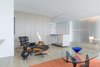 Modern home with Living Room, Chair, Light Hardwood Floor, and Coffee Tables. Living area Photo of Mies van der Rohe Gem For Sale