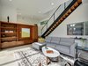 Modern home with Living Room, Bookcase, Media Cabinet, Recessed Lighting, and Concrete Floor. Built-in hardwood entertainment center, cabinets & shelving. Photo 7 of KRDB Swede Hill Modern