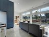 Modern home with Living Room, Recessed Lighting, and Concrete Floor. Ample built-in storage facilitates minimalist living. Fenced yard affords privacy and extends the living area. Photo 9 of KRDB Swede Hill Modern