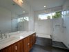 Modern home with Bath Room, Ceramic Tile Floor, Engineered Quartz Counter, Undermount Sink, Subway Tile Wall, Drop In Tub, Enclosed Shower, Wall Lighting, and Recessed Lighting. Master Bathroom Photo 11 of KRDB Swede Hill Modern