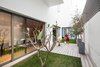 Modern home with Outdoor, Garden, Grass, Shrubs, Trees, Gardens, Raised Planters, Small Patio, Porch, Deck, Metal Patio, Porch, Deck, Planters Patio, Porch, Deck, Horizontal Fences, Wall, Concrete Patio, Porch, Deck, Metal Fences, Wall, and Landscape Lighting. Private garden with deck Photo 12 of A House in Yarmouk