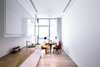 Modern home with Kitchen, Wood Counter, Ceiling Lighting, Refrigerator, Light Hardwood Floor, Pendant Lighting, White Cabinet, Drop In Sink, Microwave, and Recessed Lighting. Pantry on the upper floor Photo 3 of A House in Yarmouk