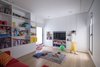 Modern home with Kids Room, Bookcase, Storage, Playroom Room Type, Light Hardwood Floor, Boy Gender, Girl Gender, and Pre-Teen Age. Kids Room Photo of A House in Yarmouk