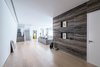 Modern home with Living Room, Chair, Pendant Lighting, Sofa, Ceiling Lighting, Recessed Lighting, Floor Lighting, Light Hardwood Floor, and Travertine Floor. Living room and entry Photo 16 of A House in Yarmouk