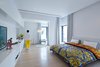 Modern home with Bedroom, Dresser, Wardrobe, Night Stands, Bed, Chair, Storage, Ceiling Lighting, Lamps, Light Hardwood Floor, Floor Lighting, Travertine Floor, and Cork Floor. Master Bedroom Photo 4 of A House in Yarmouk