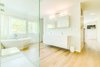 Modern home with Bath Room, Engineered Quartz Counter, Light Hardwood Floor, Wall Mount Sink, Freestanding Tub, and Open Shower. Bathroom Photo 5 of Sandbox