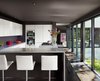 Modern home with Kitchen, White Cabinet, and Dark Hardwood Floor. Photographer: Casey Dunn Photo 10 of West Lake Hills Residence